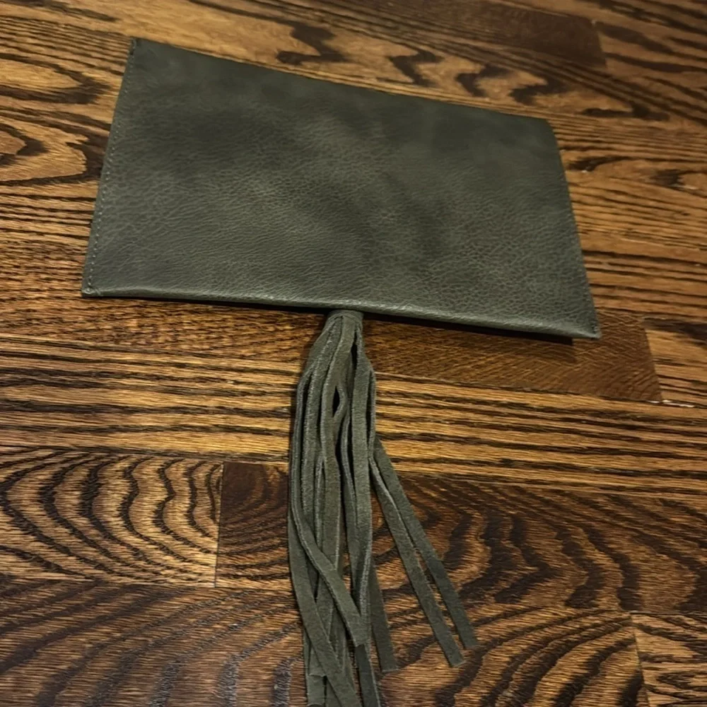 Anthropologie Street Level faux pebbled leather olive tasseled envelope clutch.